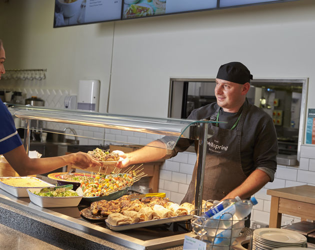 med_royal_surrey_wellspring_restaurant_staff_member_serving_food_from_counter_02.jpg